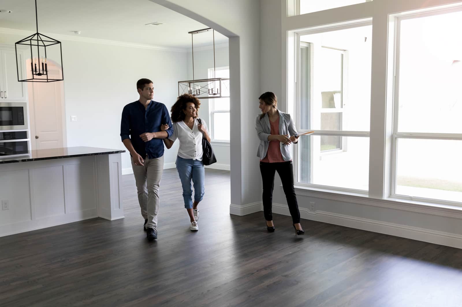 Couple meets with Real Estate Agent