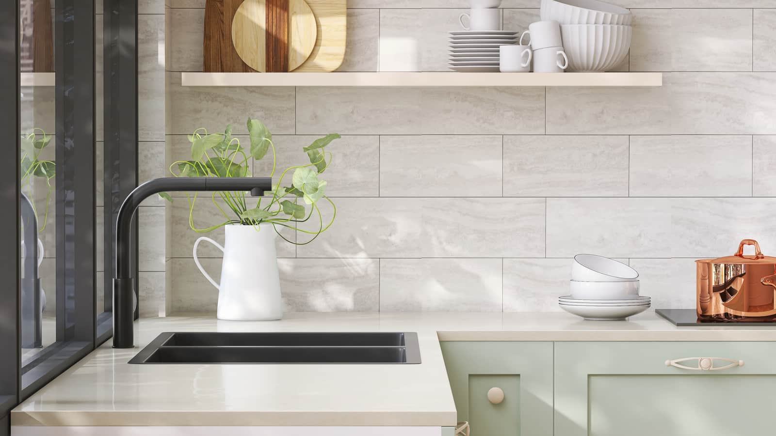 Minimal and cozy green kitchen counter with white laminated plastic top and black quartz sink with sunlight from window