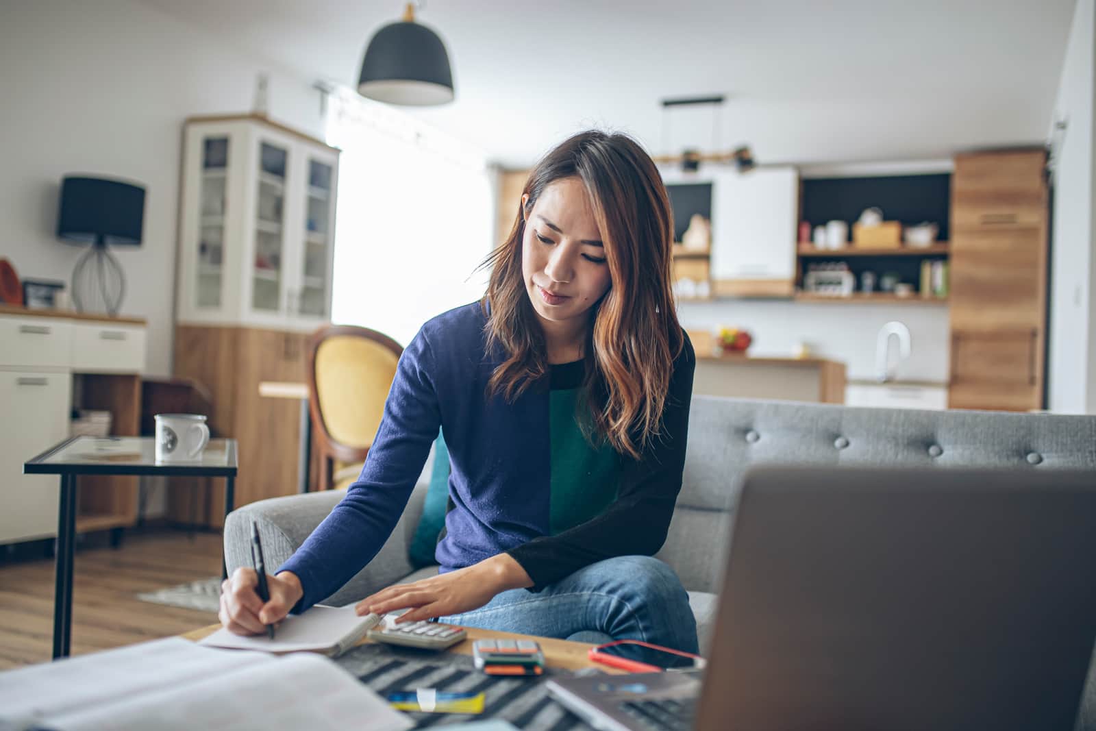 Young woman filing her taxes