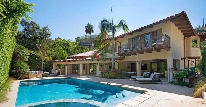 View of Chris Pratt and Anna Faris's Hollywood Hills home with a saltwater pool and spa, Mediterranean-style architecture, and outdoor entertainment spaces.