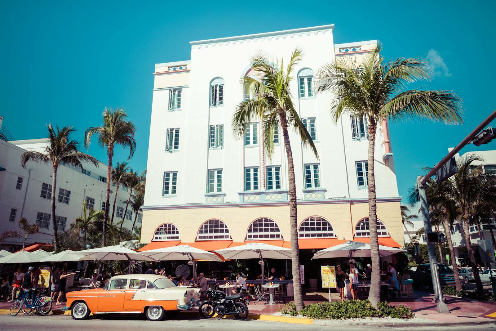 Vintage car parked along Ocean Drive in the famous Art Deco district in South Beach, Florida
